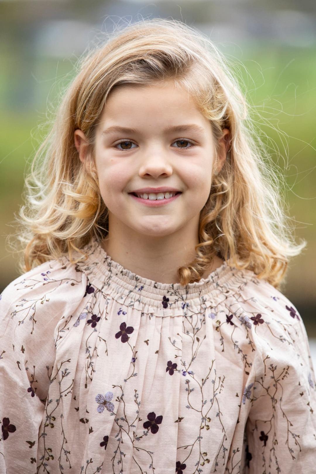 Outdoor portrait of a smiling young girl
