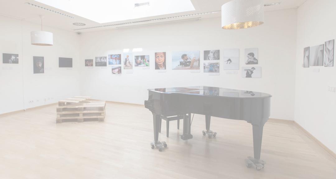 Exhibition room with photographs on the walls